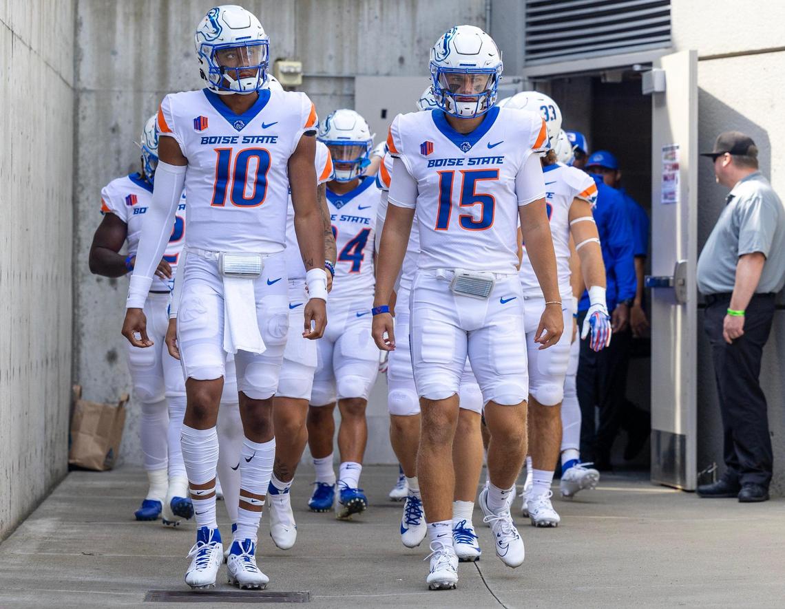 Boise State quarterbacks Taylen Green (10) and Colt Fulton exit the locker room to take the field.