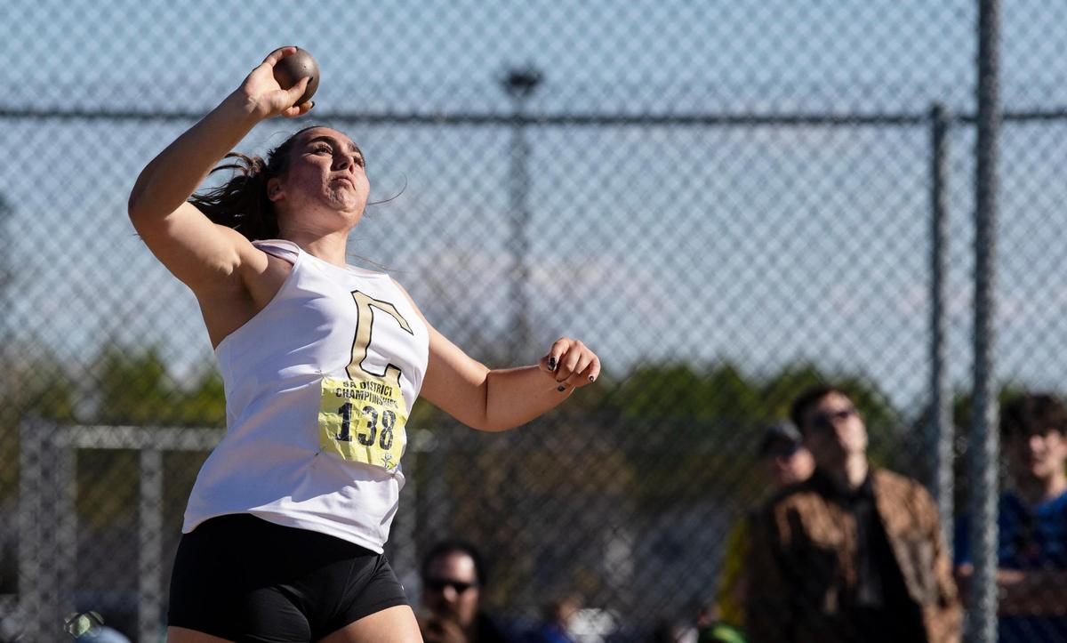 Capital’s Grace Strickland competes in the shot put during the 5A District Three track and field championships held at Kuna High School on Friday.