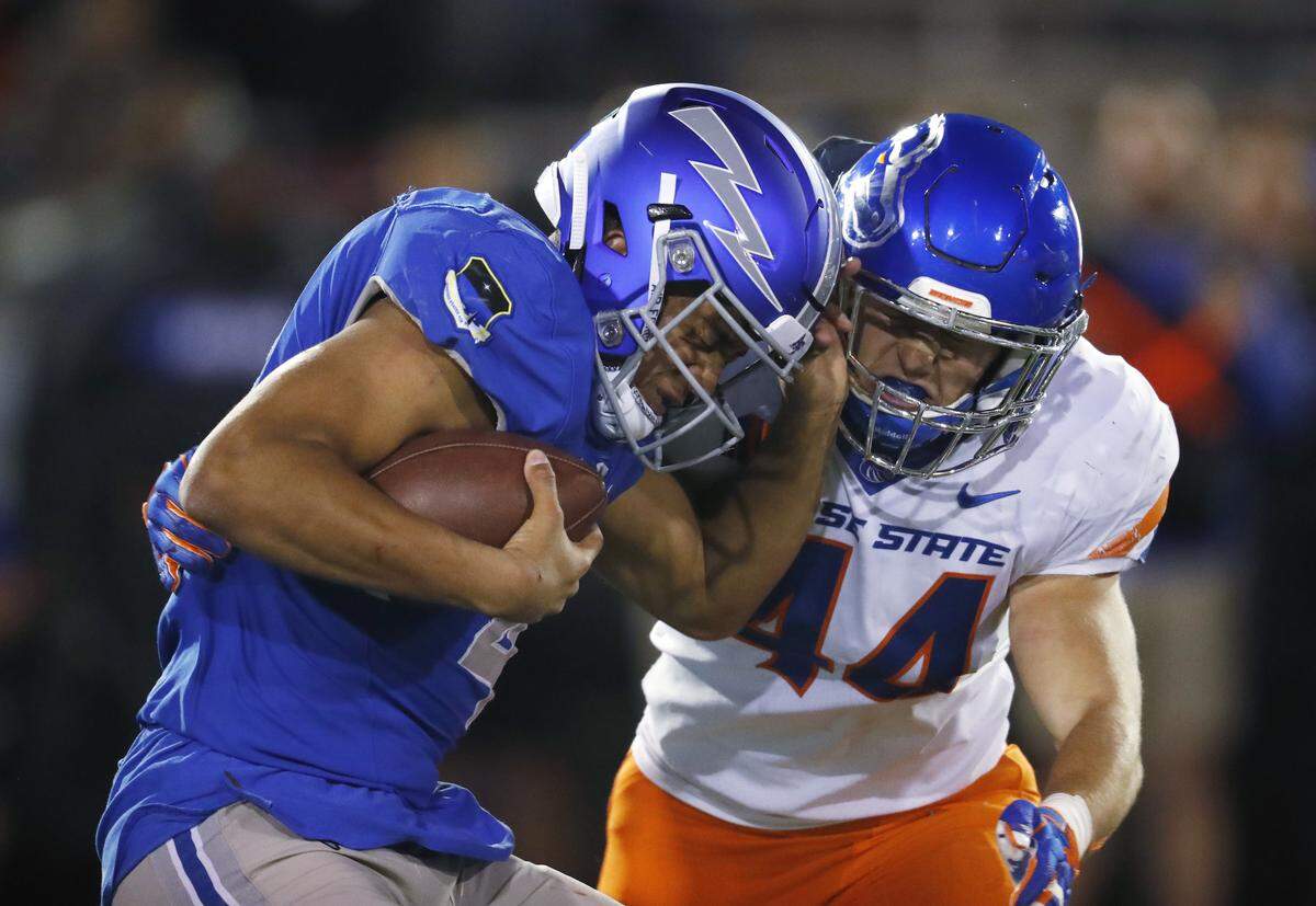 Boise State linebacker Riley Whimpey, right, sacks Air Force quarterback Isaiah Sanders in the fourth quarter Saturday, Oct. 27 at Air Force Academy, Colo.