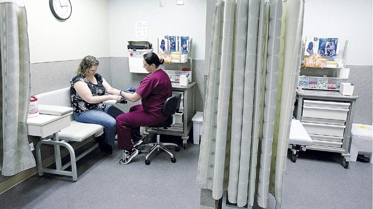 Shawna Ervin, of Nampa, has blood drawn for testing by phlebotomist Christy Cook at Saint Alphonsus Medical Center in Nampa. Some psychiatric medications carry the risk of damaging a person’s body. Ervin says her current doctor found a perfect prescription-drug regimen for her, but the drug Clozaril requires her to have blood drawn once a week to screen for signs of harm.