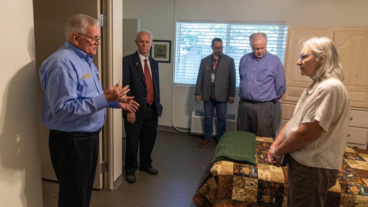 Rev. Bill Roscoe, president and CEO of Boise Rescue Mission Ministries, left, guides Ada County Commissioners Tom Dayley, Ryan Davidson and Rod Beck on a tour of a transitional housing facility in August.