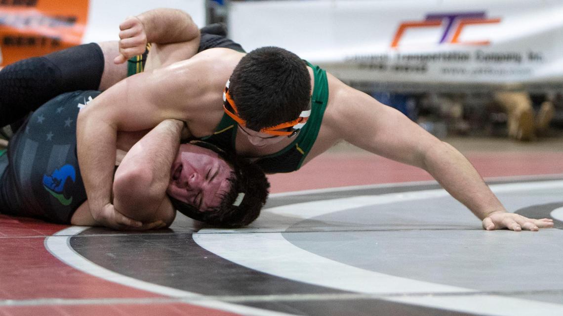 Borah’s Aden Attao pins Mountain View’s Shilo Jones in the heavyweight finals at the 5A District Three wrestling tournament Wednesday.