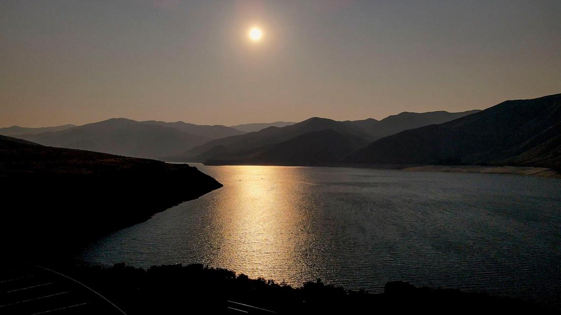 A smoky morning sun rises over Lucky Peak on Friday, Aug. 13. Wildfires in the West have choked portions of Idaho with smoky skies.