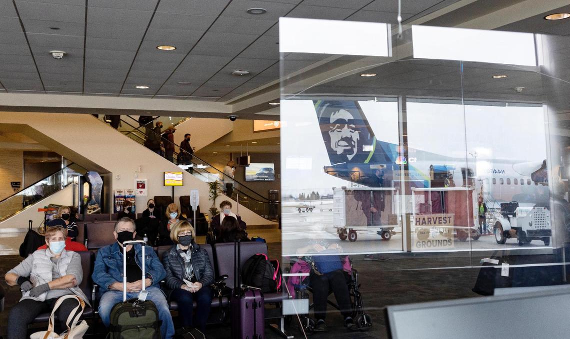 An Alaska Airlines plane is reflected in a plexiglass barrier in the terminal area of the Boise Airport on Wednesday, Jan. 5, 2021. The Boise Airport has a list of five destinations it is prioritizing for future routes, including Orlando, Honolulu, New York City-area airports, Boston and Anchorage, plus Idaho intrastate airports.