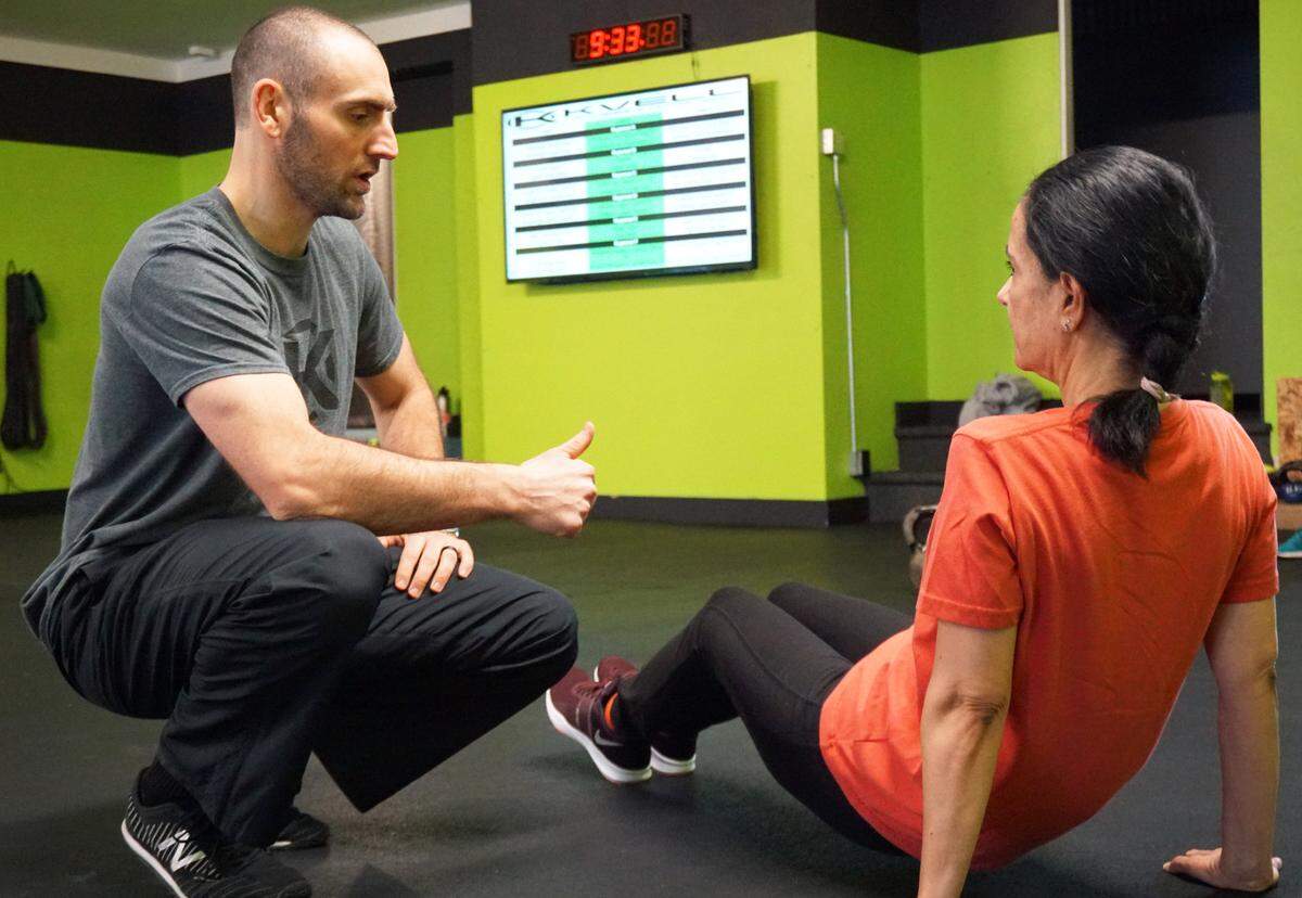 Kvell Nutrition and Fitness owner Brett Denton, left, with a “Kvellian” before the coronavirus pandemic. “We have a core group of people who are coming to train, and then we have everybody else, who are scared to come in and train, because they think gyms are going to get them sick,” Denton said.