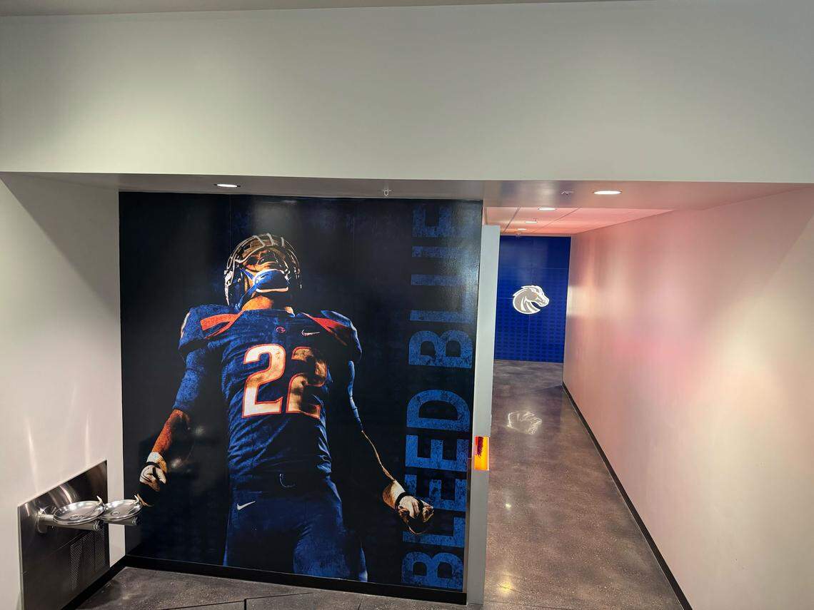 A floor-to-ceiling image of former Boise State running back Doug Martin is plastered on the wall next to the team room at the Bleymaier Football Center.