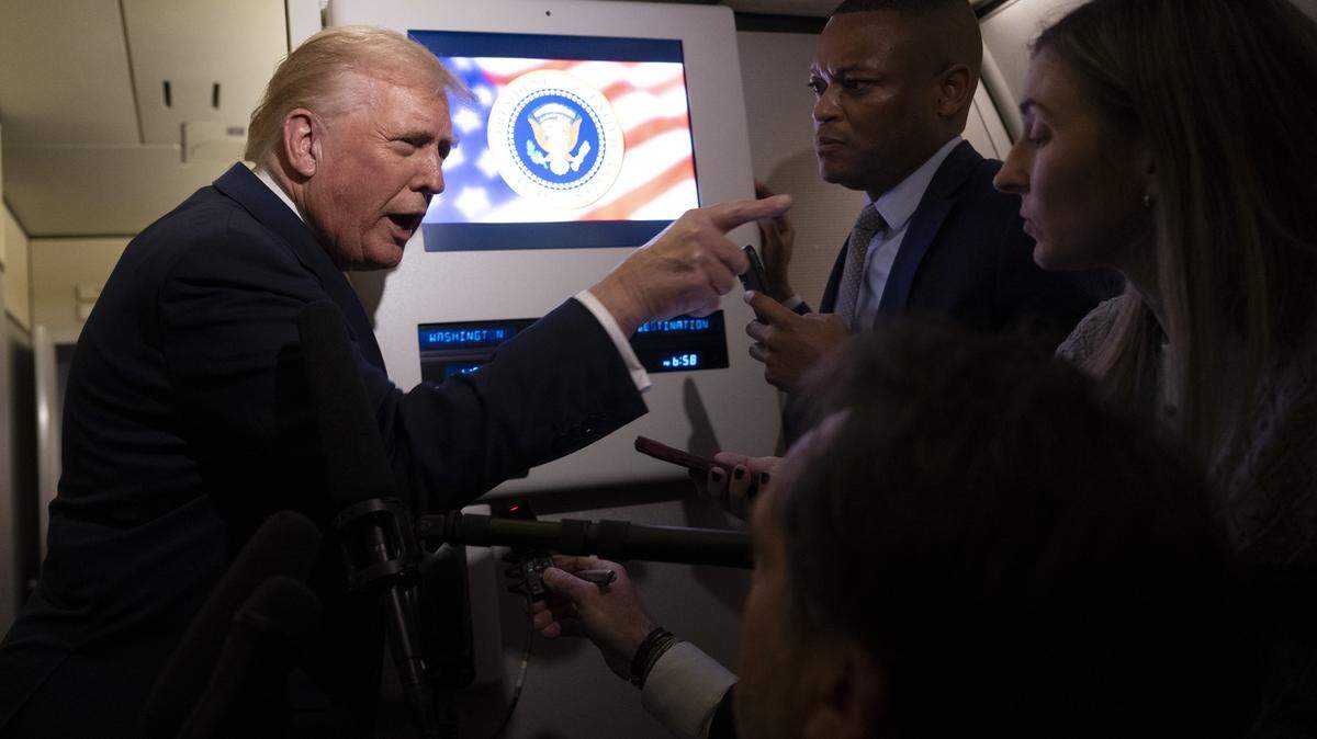 IN FLIGHT - NOVEMBER 14: U.S. President Donald Trump speaks to members of press aboard Air Force One on November 14, 2025 while in flight from Washington, DC to West Palm Beach International Airport. Trump is scheduled to spend the weekend at his Mar-A-Lago estate in Palm Beach, Florida. (Photo by Roberto Schmidt/Getty Images)