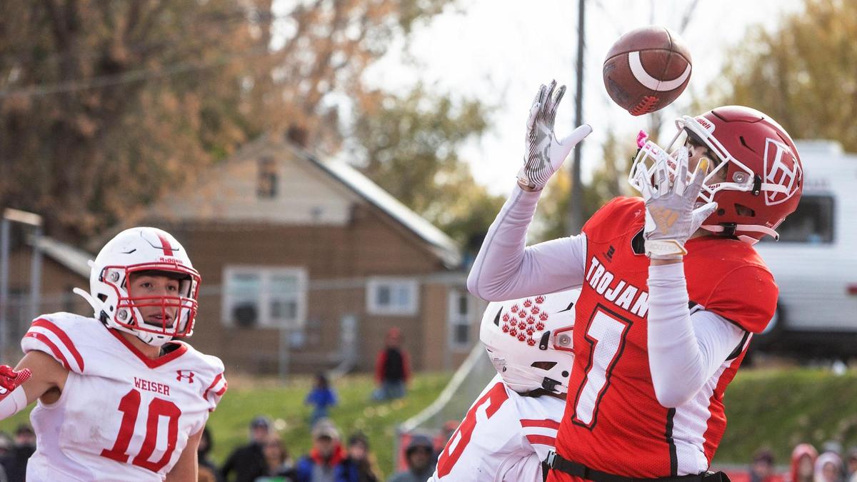 Homedale’s Dillon Fine hauls in a juggling catch in last year’s 3A state semifinals. He will become the starting quarterback for the Trojans this fall as they try to make it six league titles in a row.