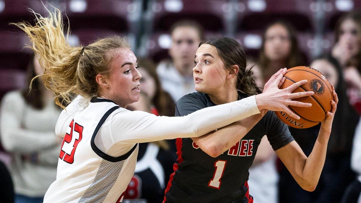 Owyhee’s Josie Davis fights off pressure from Boise forward Avery Howell on Feb. 16.