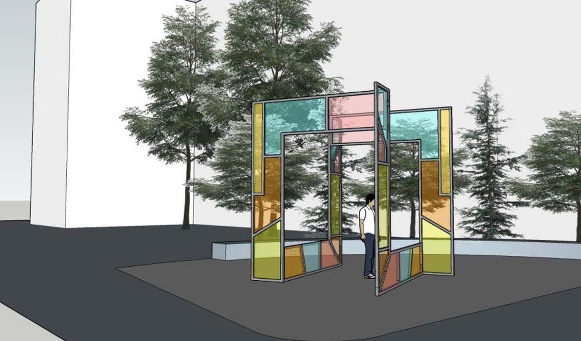 The double archway of the art piece to be erected next to the Pioneer Crossing building at the northeast corner of 13th and Myrtle streets uses four sunrise and sunset colors. “A subtle etch of shapes emulates the aggregate that is inside and outside the building. In our interiors concept, this aggregate is an homage to the trails and roads that wind around the building and connect the downtown,” designer KovichCo of Boise wrote in the application to the city of Boise.