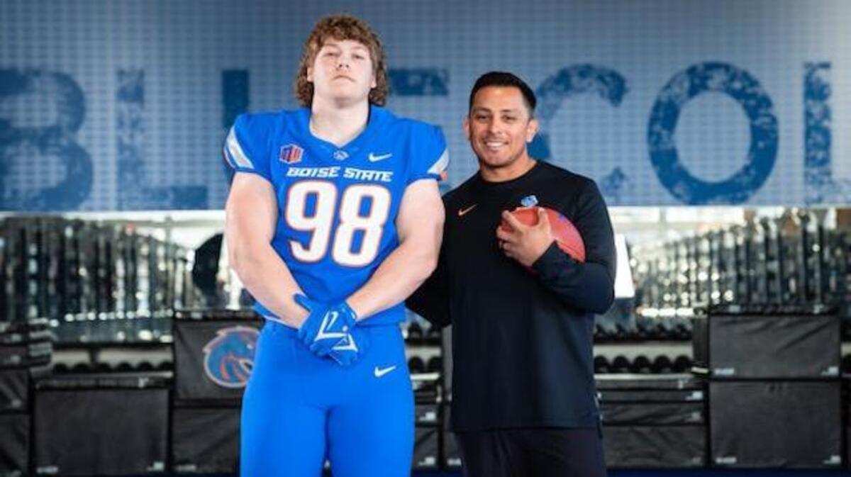 Three-star defensive lineman Hayden Hanks poses with Boise State football coach Andy Avalos during a visit April 8. Hanks verbally committed Thursday, becoming the first player in the Broncos’ 2024 class. 