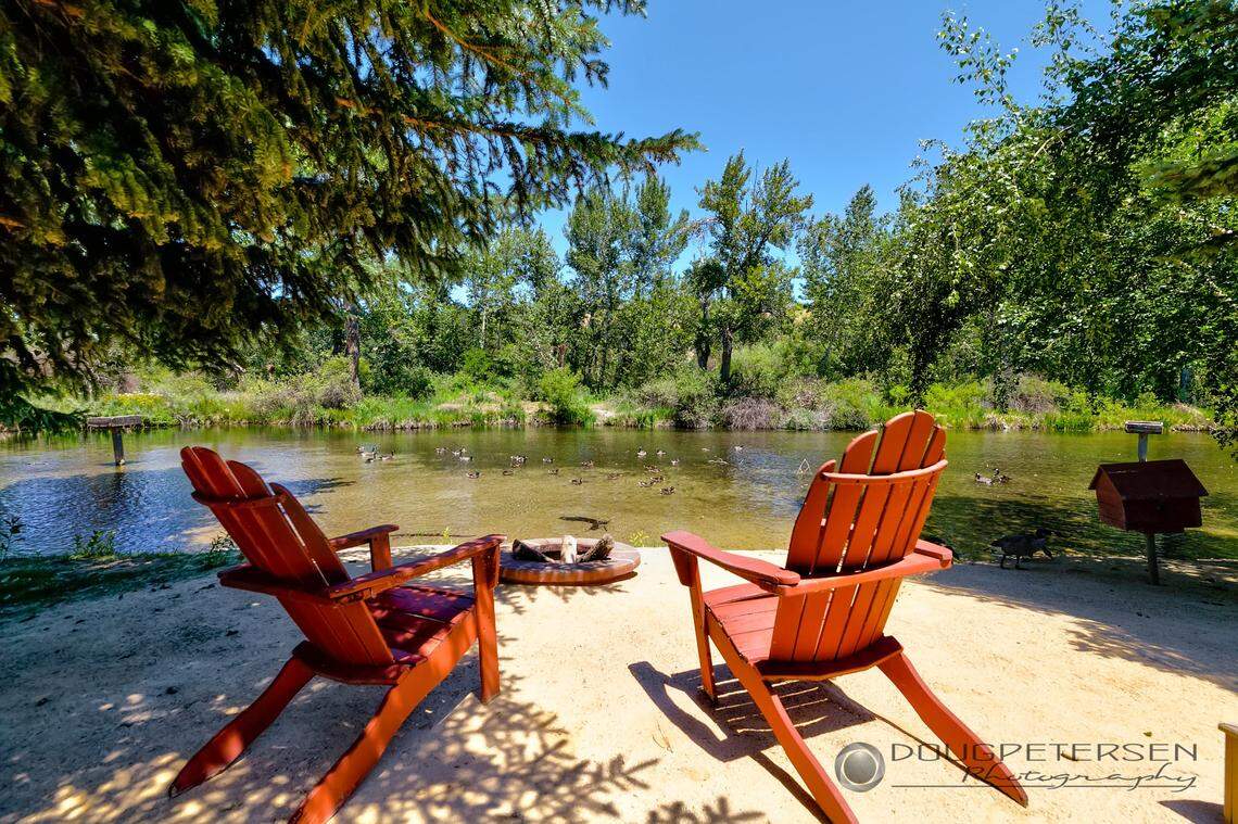 The house was designed to be a space for those who like to entertain. It includes this fire pit and a private beach.