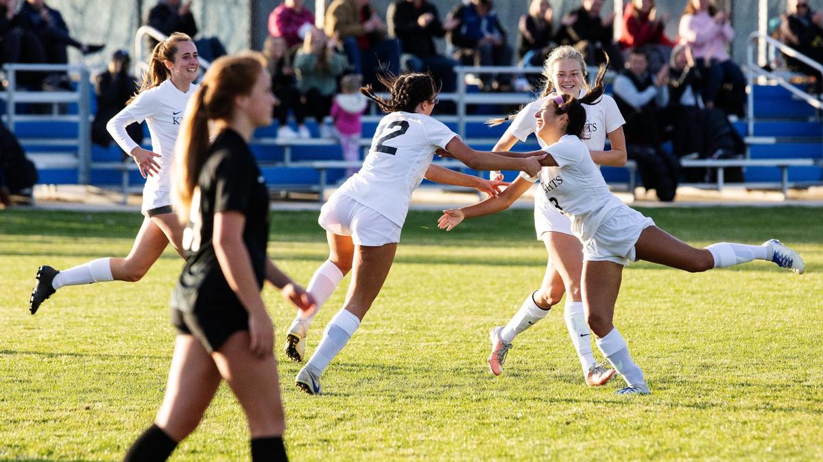 Bishop Kelly forwards Grace Houser and Izzy Reyes celebrate after a goal by Reyes in the second half of the 4A District Three Tournament championship game Thursday at Middleton High School. Bishop Kelly beat Vallivue 5-0.