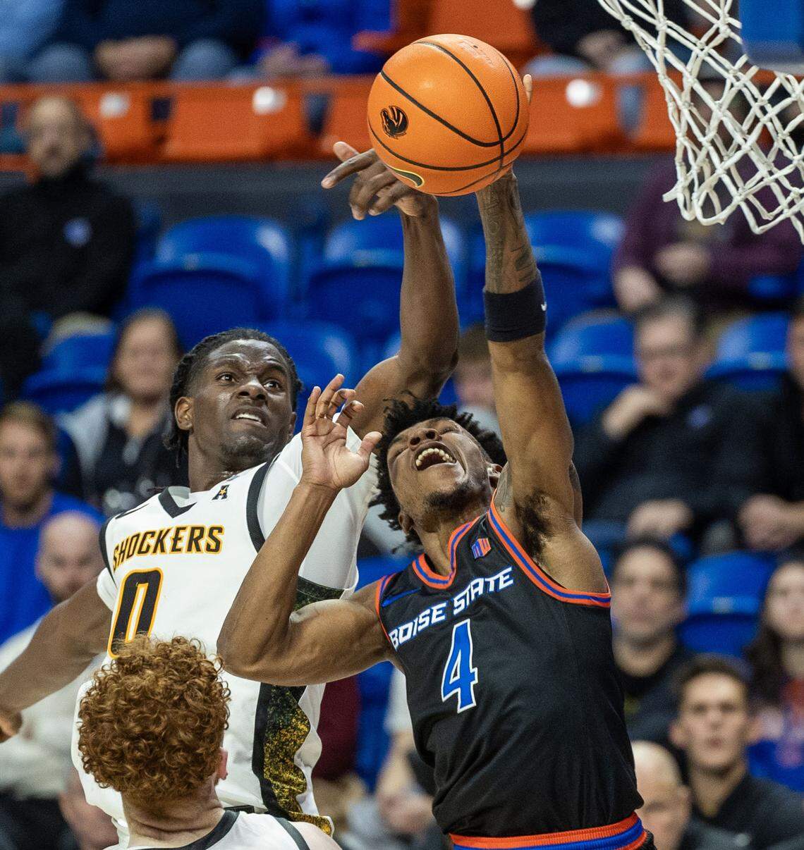 Boise State guard Dylan Andrews draws a foul on Wichita State forward Karon Boyd in the second half at ExtraMile Arena in Boise, Tuesday, Nov. 18, 2025.