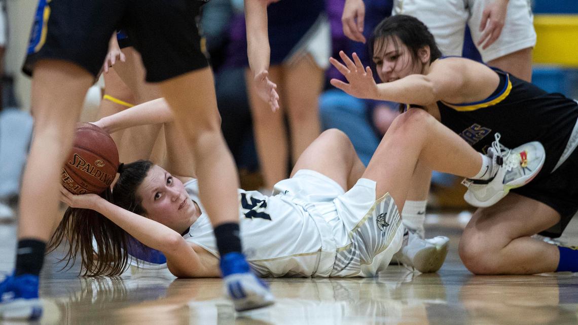 Middleton senior Sylvia Conley looks to pass under pressure from Caldwell’s Courtney Williams during the 4A District Three girls basketball championship Thursday, Feb. 13, 2020 at Caldwell High School.