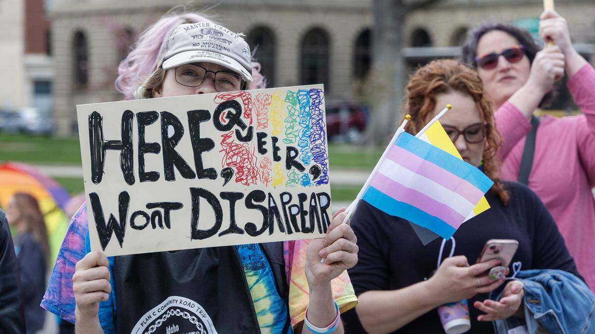 People gather outside the Idaho Capitol in Boise for a Trans Day of Visibility rally, Tuesday, March 31, 2026.