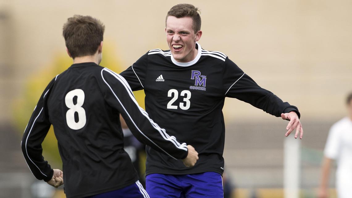Rocky Mountain senior Kyle Jones (8) celebrates with teammate Jake Daniels (23) after Jones’ second goal against Timberline in the Grizzlies’ 4-0 win in the 5A District Three boys soccer championship game Wednesday at Mountain View High School in Meridian.
