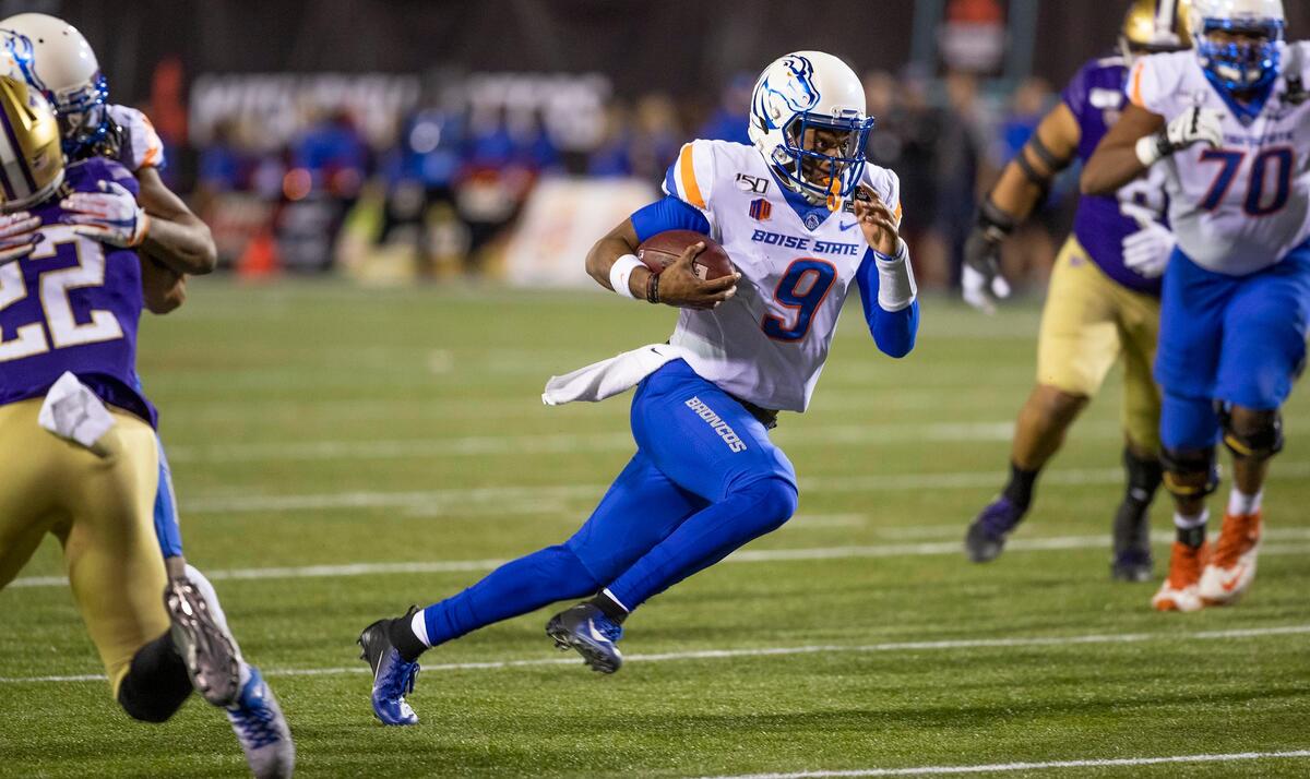 Boise State quarterback Jaylon Henderson cuts up field to gain a first down in the third quarter of the Broncos’ 38-7 loss to Washington in the Las Vegas Bowl.