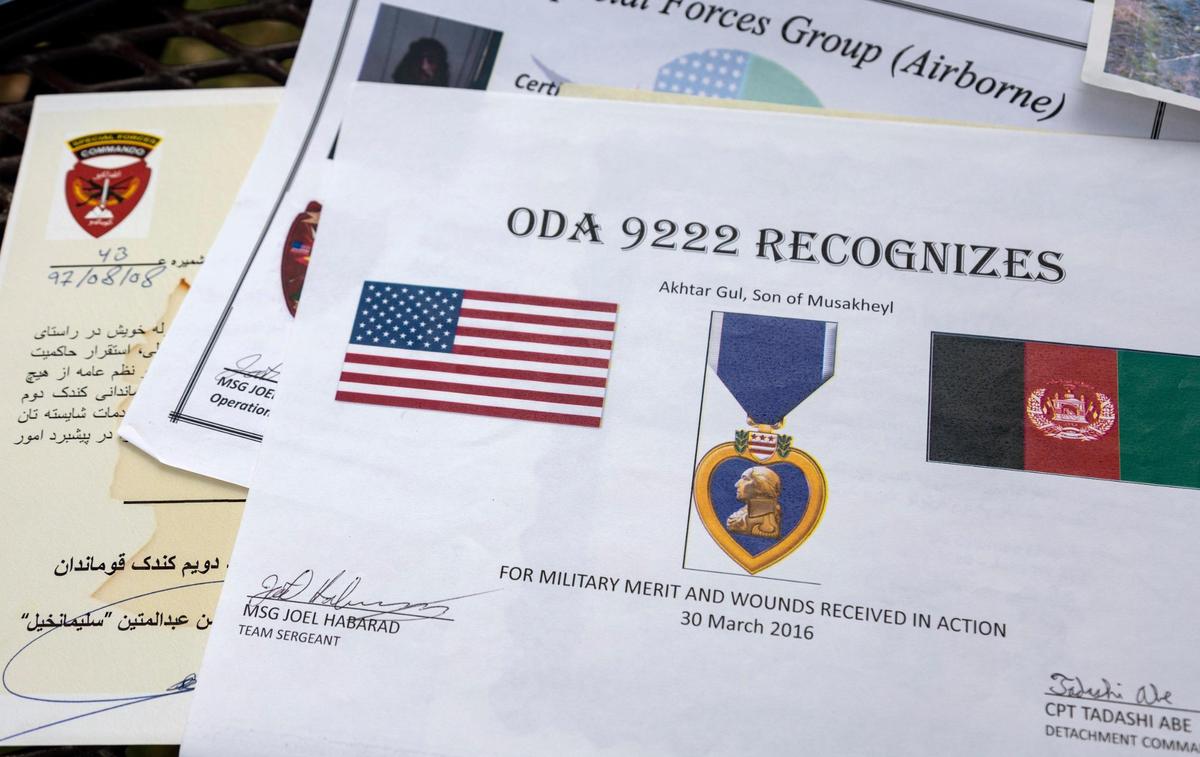 Akhtar Gul Silab brought many of his military certificates with him when he fled Afghanistan with his family three weeks ago. They now live in Boise.