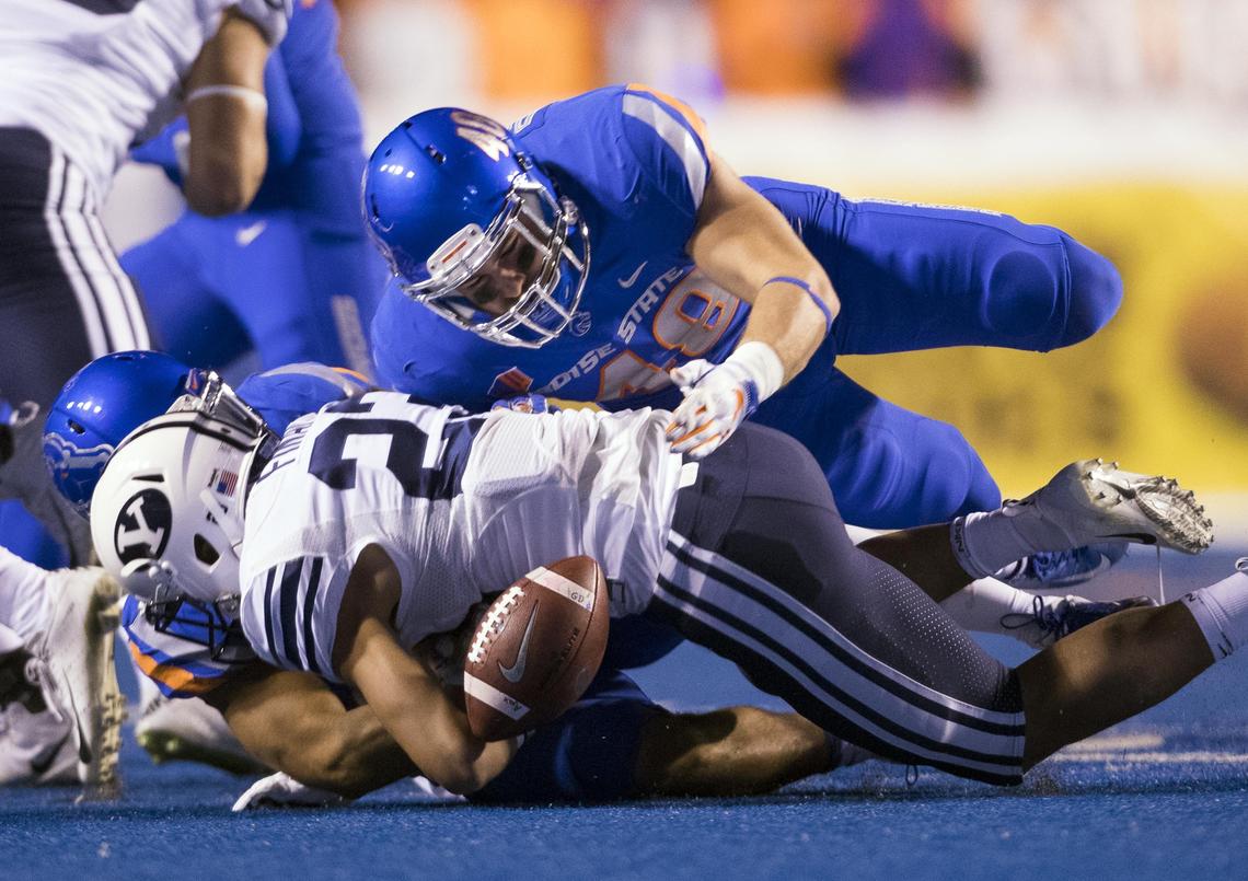 Boise State’s Bruno DeRose, top right, and Avery Williams force a fumble by BYU’s Zayne Anderson on a kickoff return last season at Albertsons Stadium in Boise.