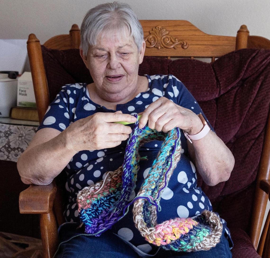 Gayle Salsman crochets a small rug for the back door of her Boise town house. Salsman grew up in Montana, working at a motel until becoming a nursing assistant later in life.