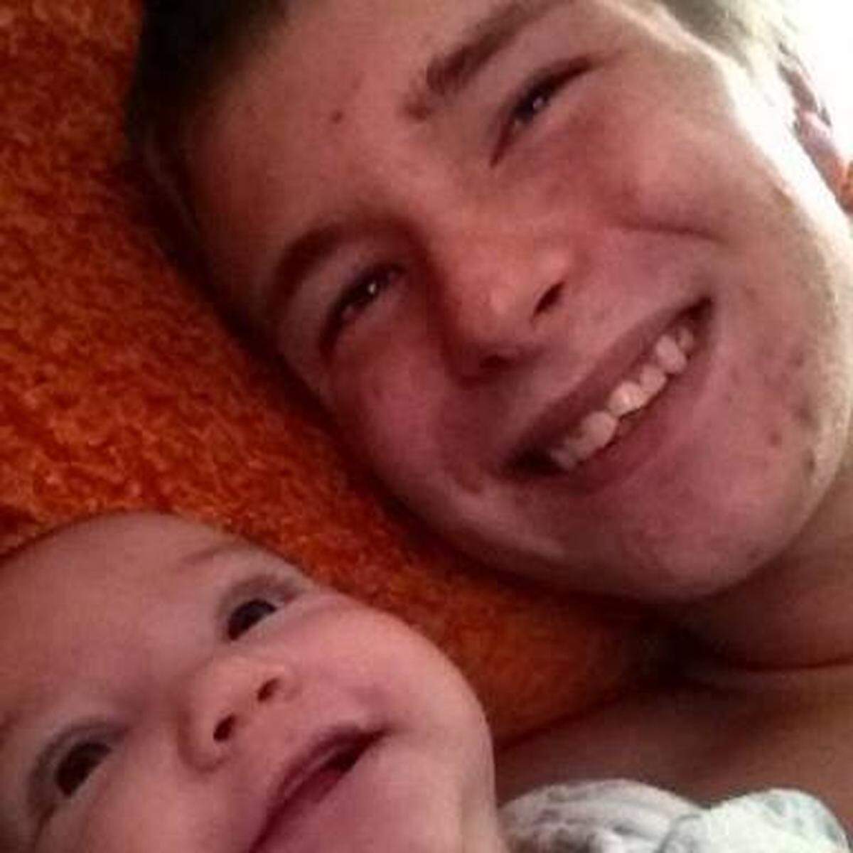Hunter Smith with his baby daughter, Saphria.