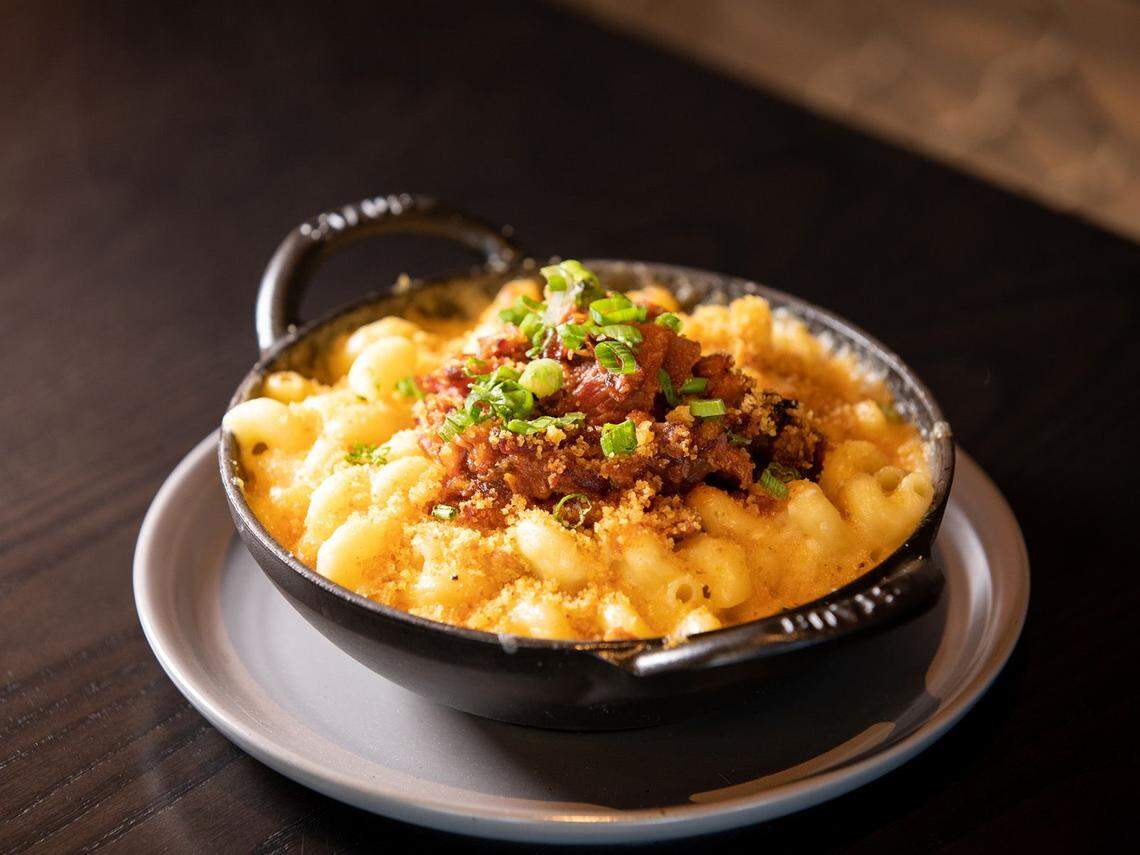 Creative takes on macaroni and cheese, such as this rib tip version, inspire the Mac ‘n Cue menu.