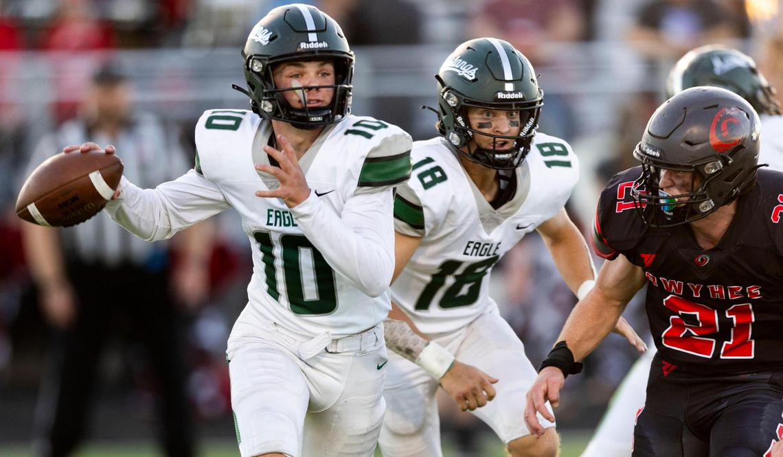 Eagle quarterback Austin Ramsey, left, winds up for a pass against Owyhee last season.