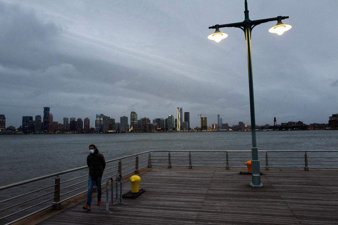 A man wears a face mask as he walks on Pier 45 in Hudson River Park on April 30, as the coronavirus pandemic was upending lives across the United States and taking a toll on people’s mental health and stress levels.