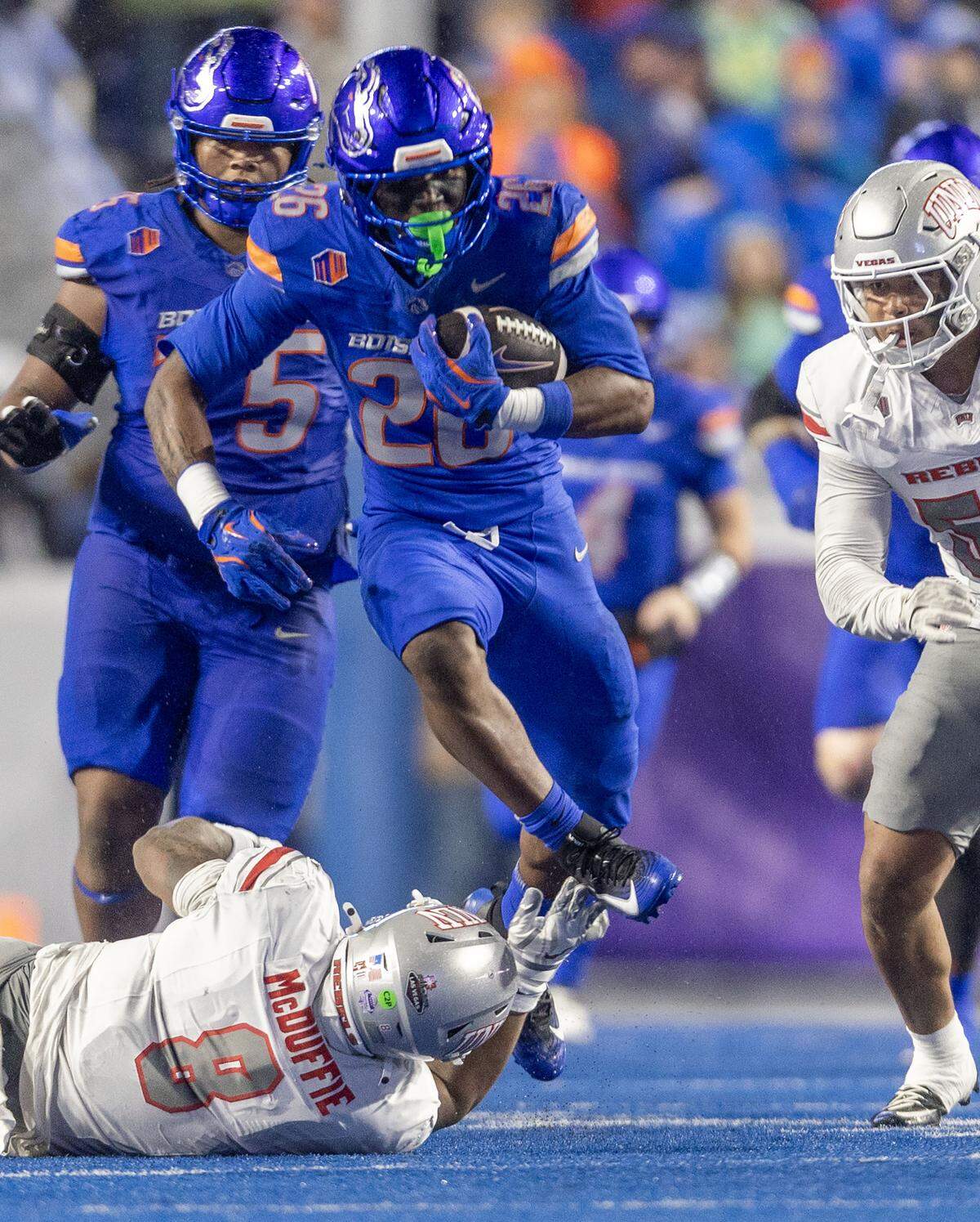 Sire Gaines leaps over UNLV linebacker Marsel McDuffie on a big gain in the Mountain West championship game Dec. 5 at Albertsons Stadium.