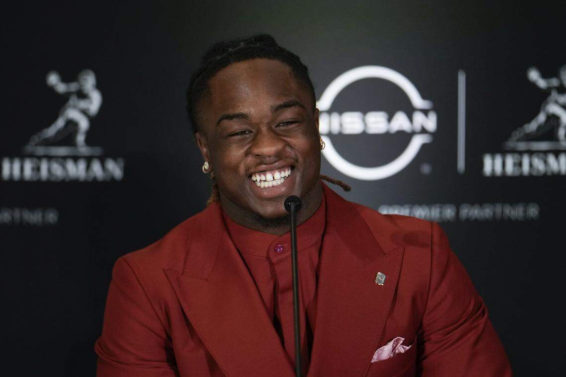 Boise State running back Ashton Jeanty smiles on stage during a press conference before the 2024 Heisman Trophy Presentation in New York.