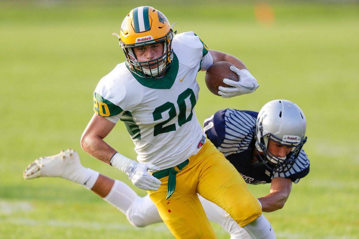Borah’s Chase Nett gets past a Skyview defender on his to way to the end zone on Friday night at Skyview High in Nampa.