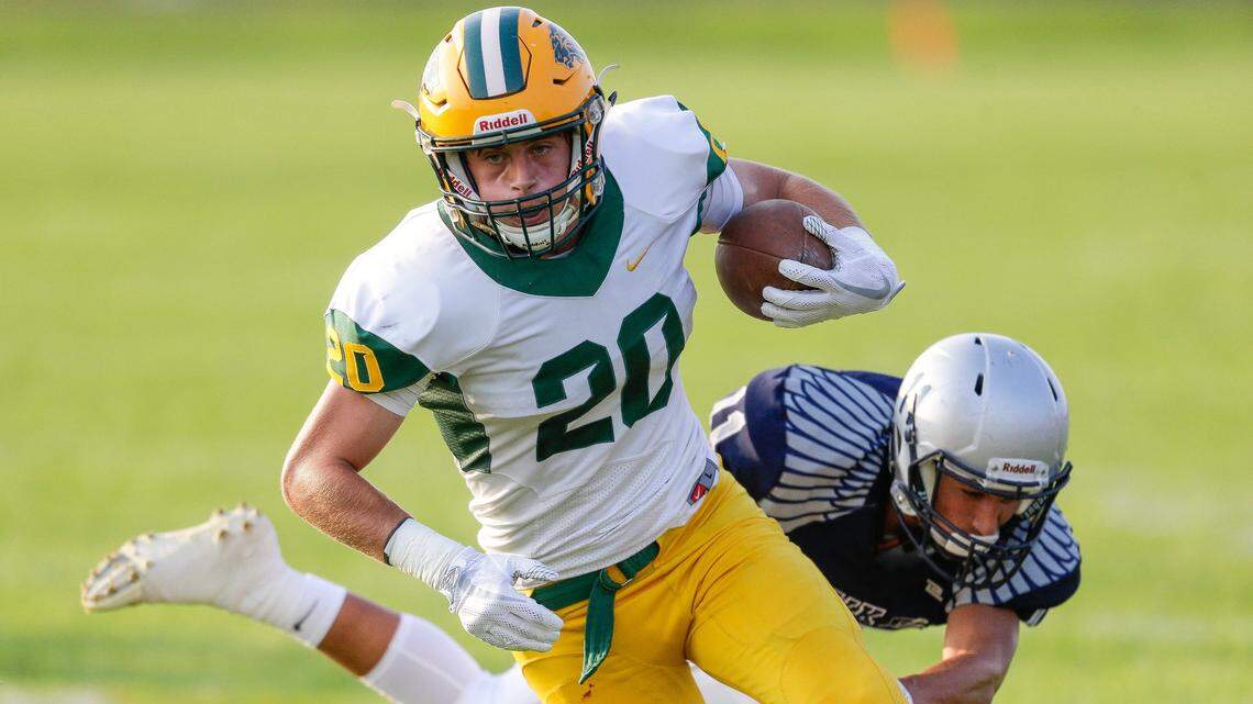 Borah’s Chase Nett gets past a Skyview defender on his to way to the end zone on Friday night at Skyview High in Nampa.