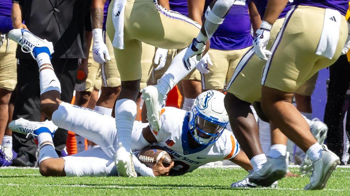 Boise State quarterback Taylen Green slides while keeping the ball in the first half of their game against University of Washington at Husky Stadium in Seattle in this Sept. 2 file photo.