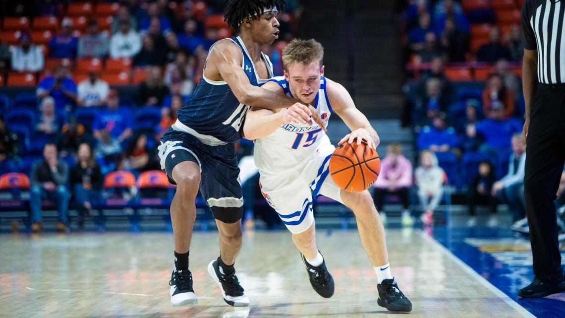 Boise State guard Jace Whiting is fouled by New Orleans guard Marquez Cooper in the first half Dec. 13 at ExtraMile Arena in Boise.