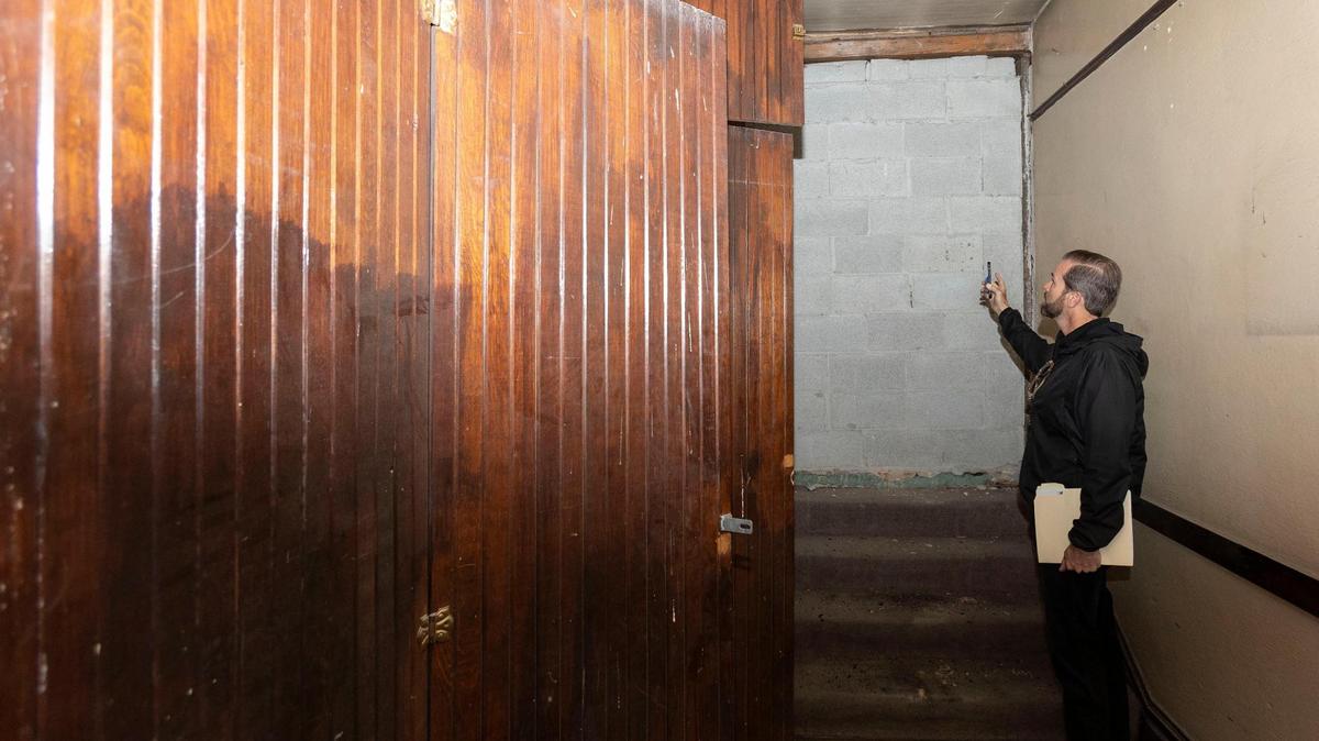 Building owner Jade Stacey points to the now-bricked-over secret entrance that previously connected the Smith Block building, 1015 W. Main St., with the neighboring Safari Inn, previously the Hotel Grand, suggesting a possible nefarious history of the second floor, which remains much the way it was built in 1905.