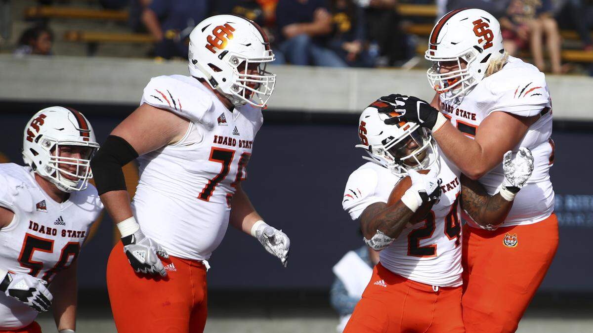 Idaho State running back Ty Flanagan, second from right, celebrates after scoring a touchdown against California on Sept. 15, 2018, in Berkeley, Calif.