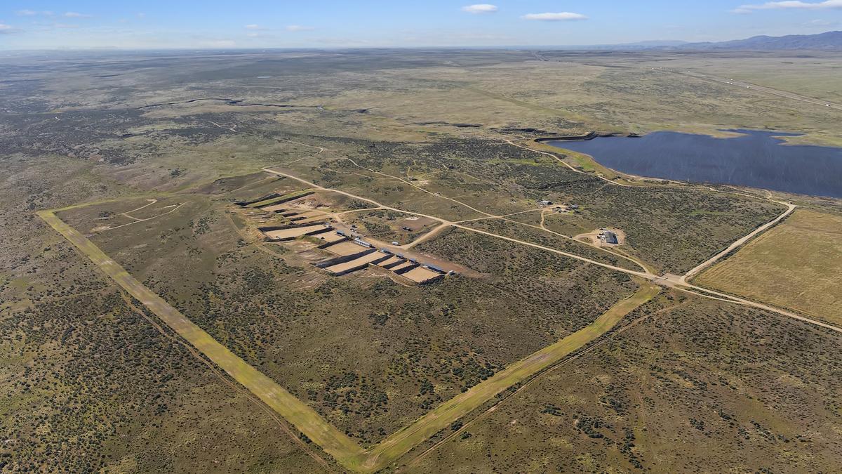This northeast-facing aerial view shows the property in the center and the Indian Creek Reservoir at center right. Interstate 84 is behind the reservoir.
