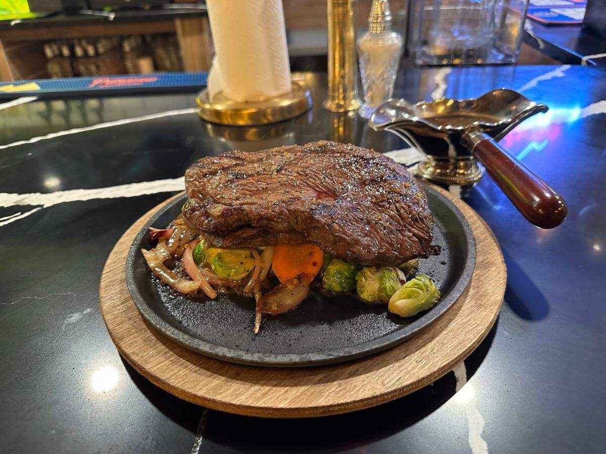 A 10-ounce sirloin steak with veggies is on the menu.