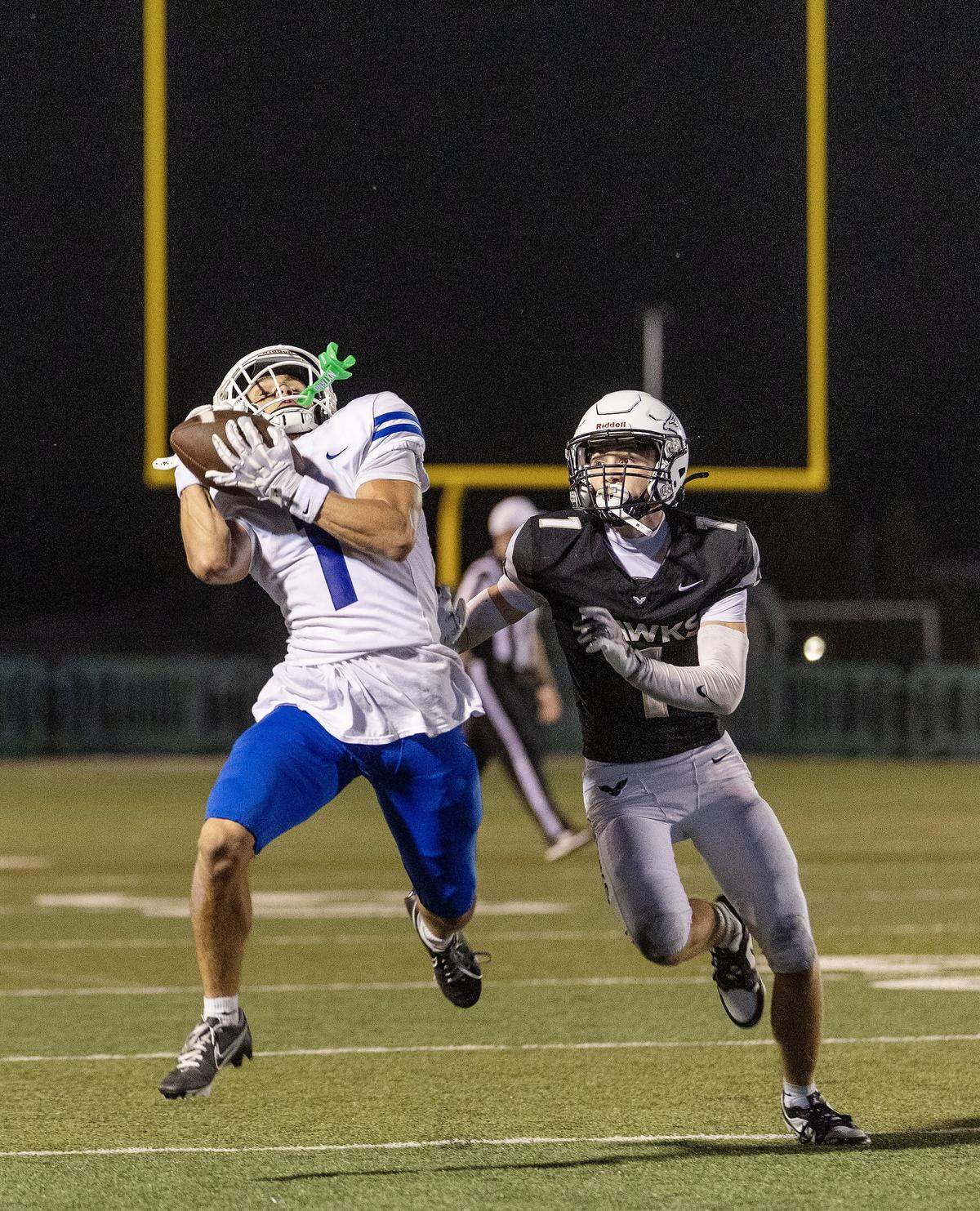 Timberline senior wide receiver Hudson Lewis catches the ball as Nelson (Ore.) senior Nico Brugato defends in the first half of their football game held at Eagle High School, Friday, Sep. 5, 2025.