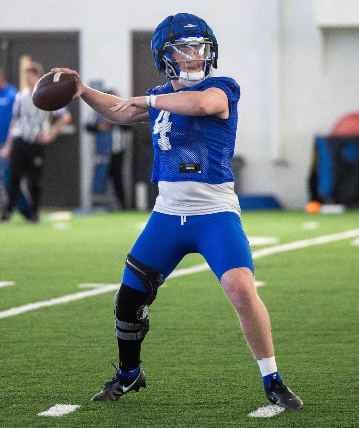 Boise State quarterback Maddux Madsen, still wearing a knee brace while recovering from MCL and PCL surgery in his right knee, delivers a pass during the Broncos’ first spring practice in 2024. Madsen was a limited participant in spring ball, but won the starting QB job in fall camp.