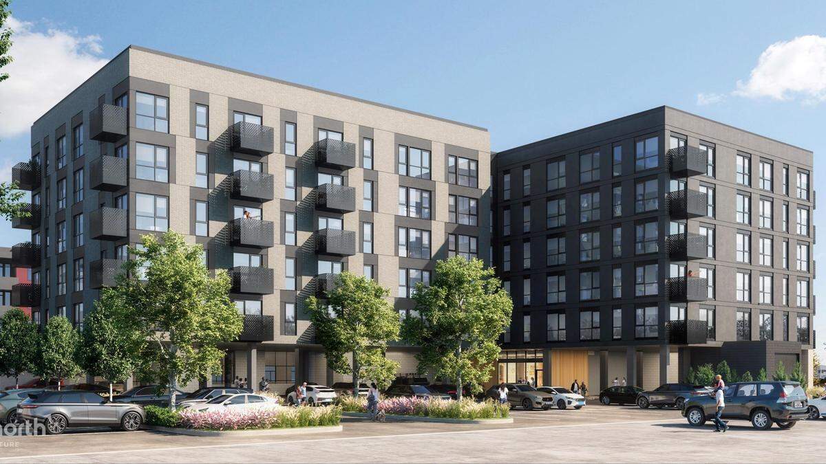 This view shows the north side of the building from the alley between 24th and 25th streets. A sliver of the Adare affordable-apartment building across Fairview is visible at left.