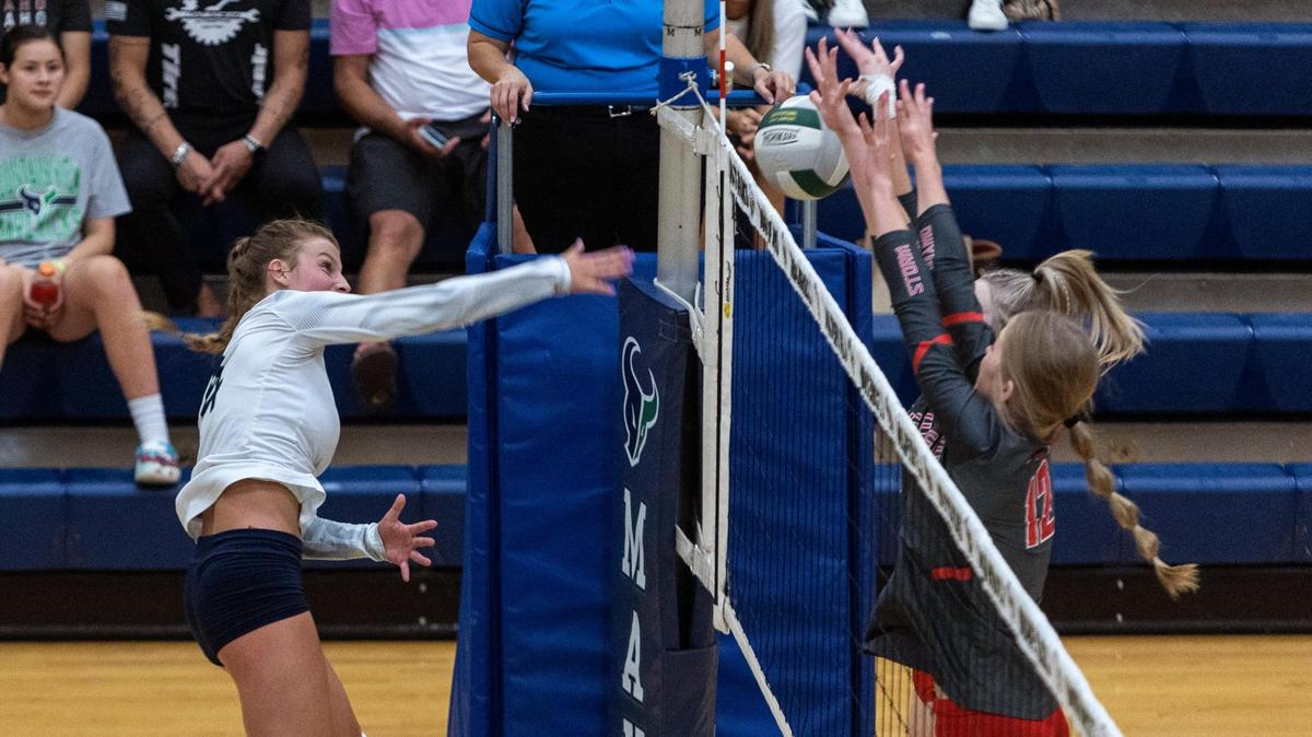 Mountain View senior Sierra Grizzle hits through the Owyhee block during their game at home against Owyhee on Thursday. The Mavs defeated the Storm 25-16, 25-21, 25-18 to remain unbeaten in 5A SIC play.