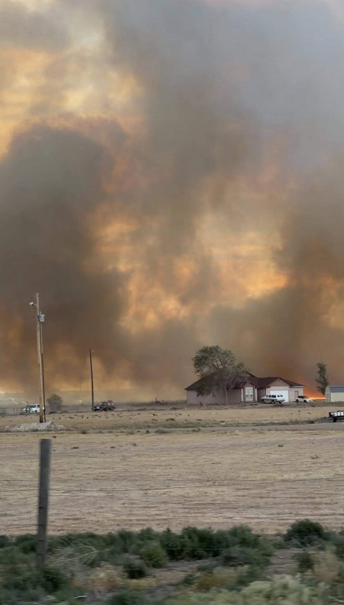 A fast-moving brush fire in Mountain Home caused smoky skies.