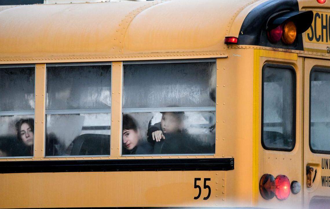Lakeland Junior High School students ride the bus to school in Rathdrum on Wednesday, Dec. 2. Lakeland School District in North Idaho has a masks-optional policy.