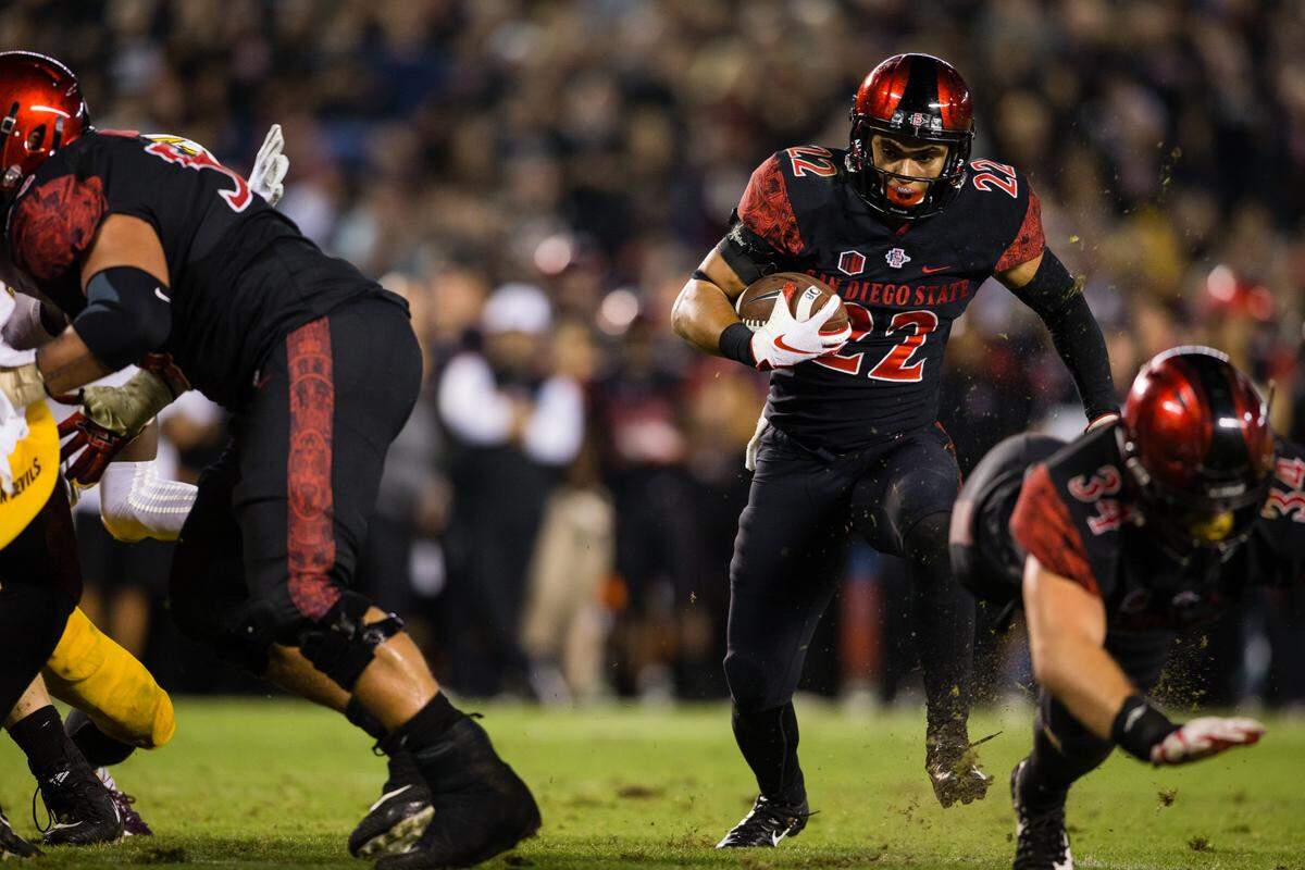San Diego State running back Chase Jasmin (22) rushes the ball during the fourth quarter Sept. 15 against Arizona State at SDCCU Stadium in San Diego.