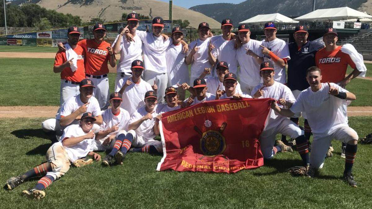 The Mountain View Toros pose with their Double-A American Legion Northwest Regional championship banner Sunday. Its the first regional championship in the program’s history.