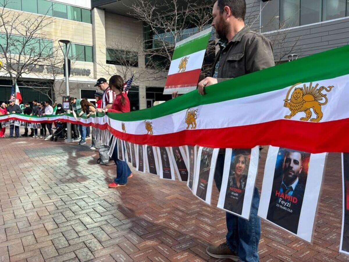 The demonstrators held photos of people killed during protests against the Islamic Republic of Iran during the last few weeks.