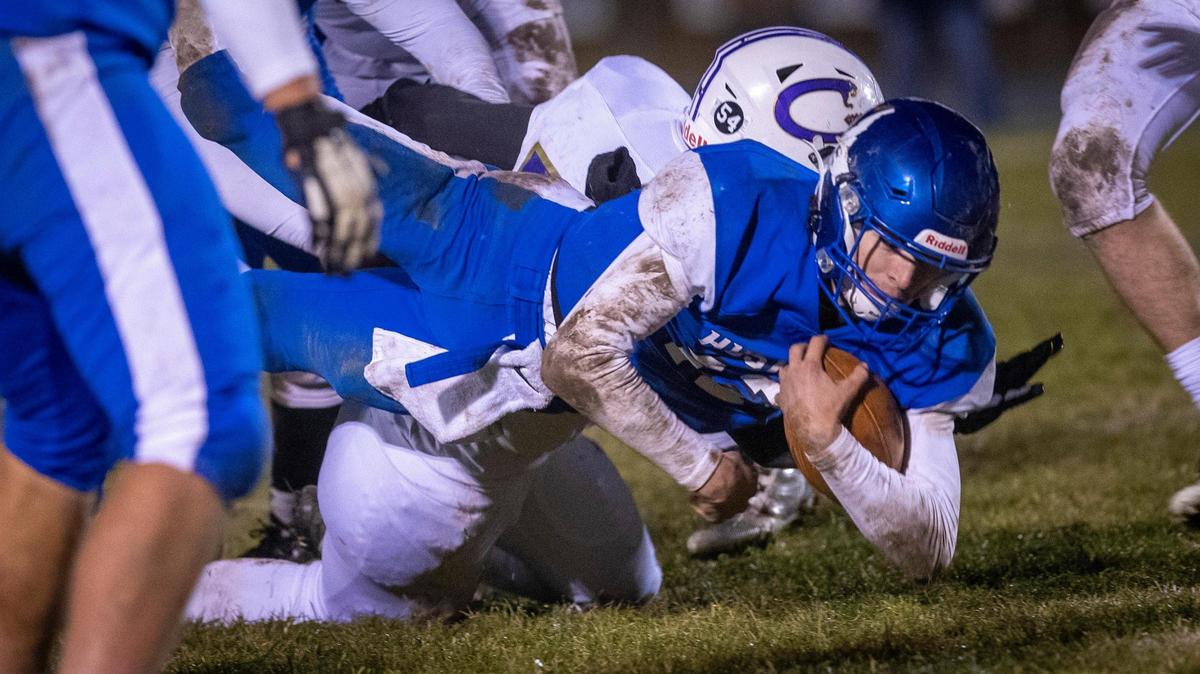 Emmett quarterback Caden Young dives forward for extra yardage Friday. The Huskies beat Century 27-22 to advance to the first 4A state championship game in program history.