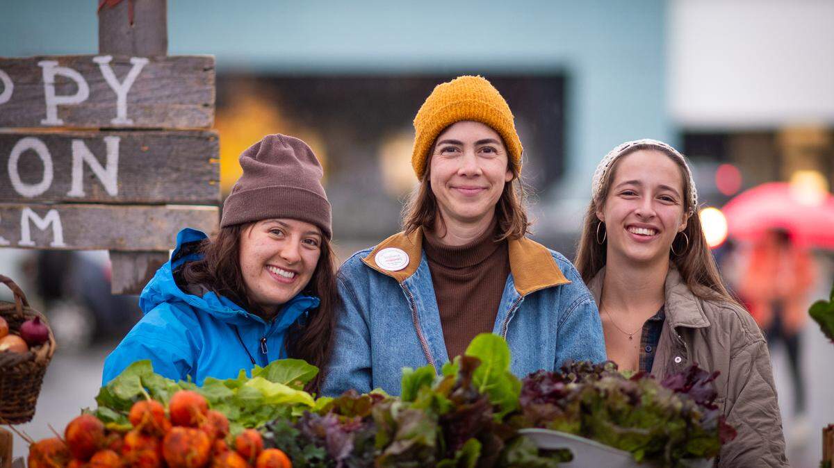 Saturday, April 4, marked 14 seasons of fresh local food coming to Boise through the farmers market. From left: Makenzie Shirey of Boise; Stephanie Ertz, Nampa resident and proprietor of Happy Heron; and Mia Moore of Boise. 